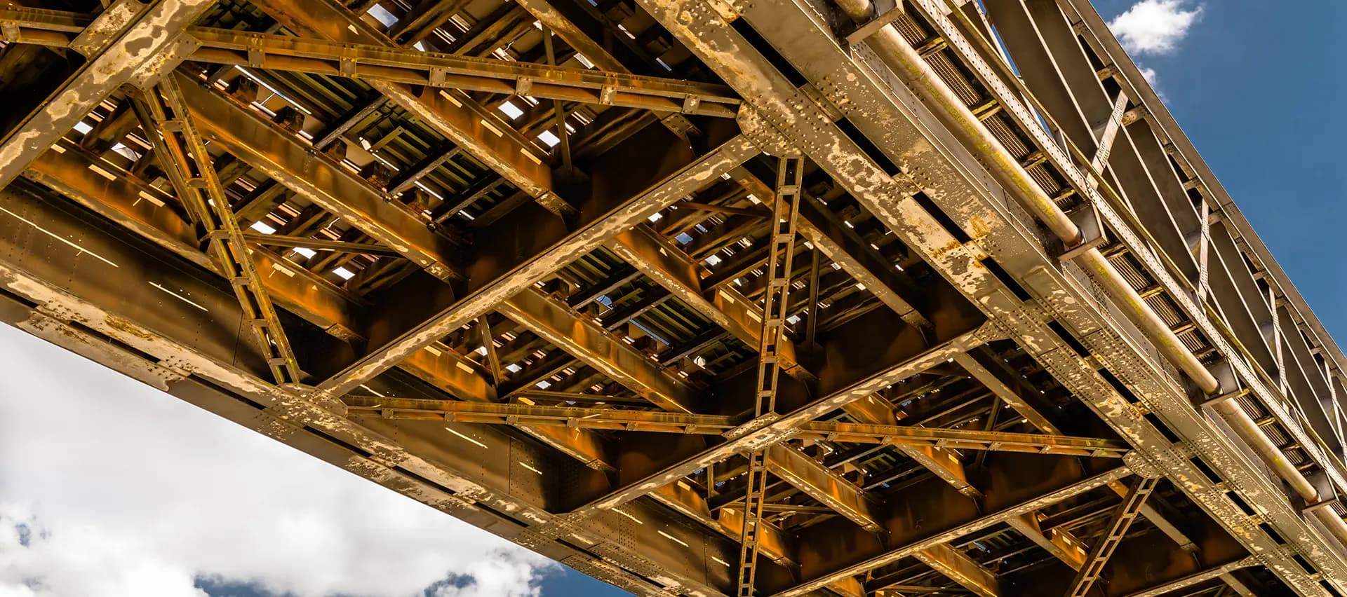A bridge with a complex lattice, showing the importance of reliable connections in structural engineering.