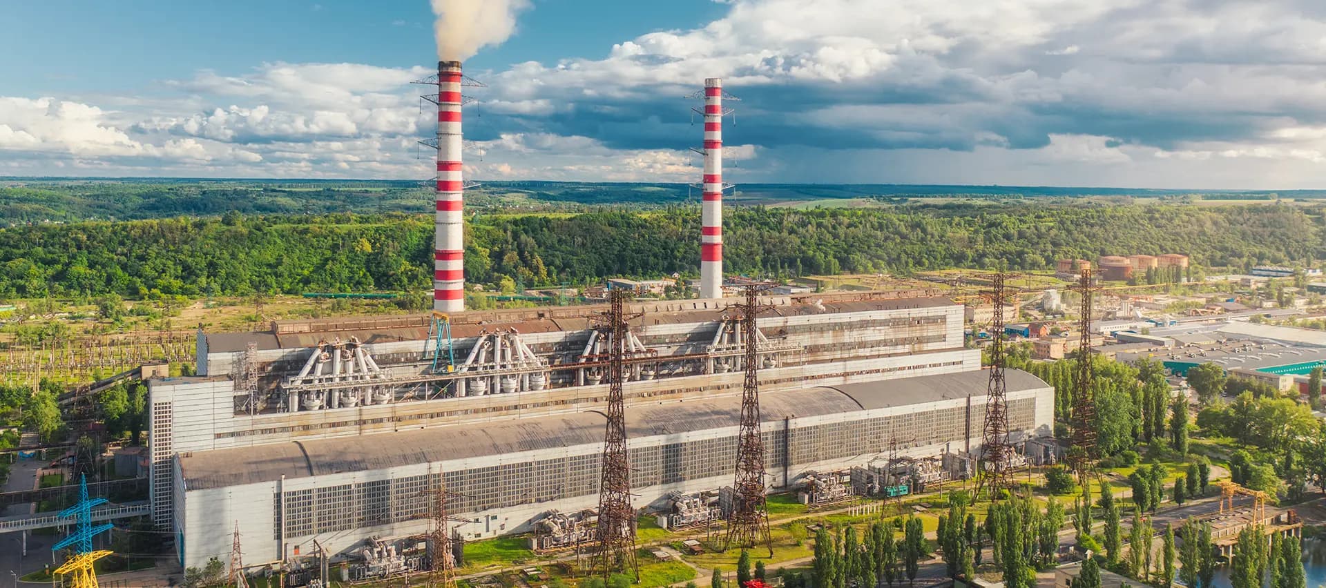 A thermal power generation facility, showing the large scale of the operation and the complexity of the machinery involved.