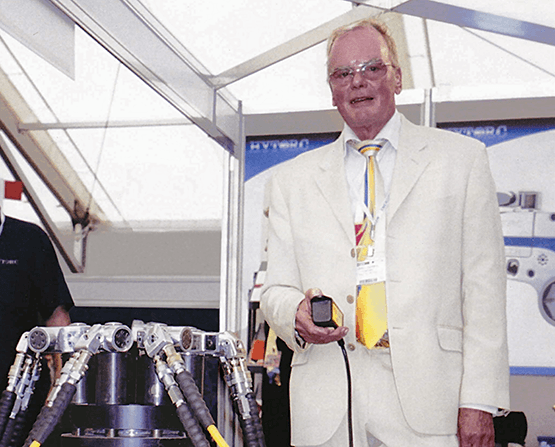 An image of John Junkers, founder of HYTORC, demonstrating Simultorc technology.