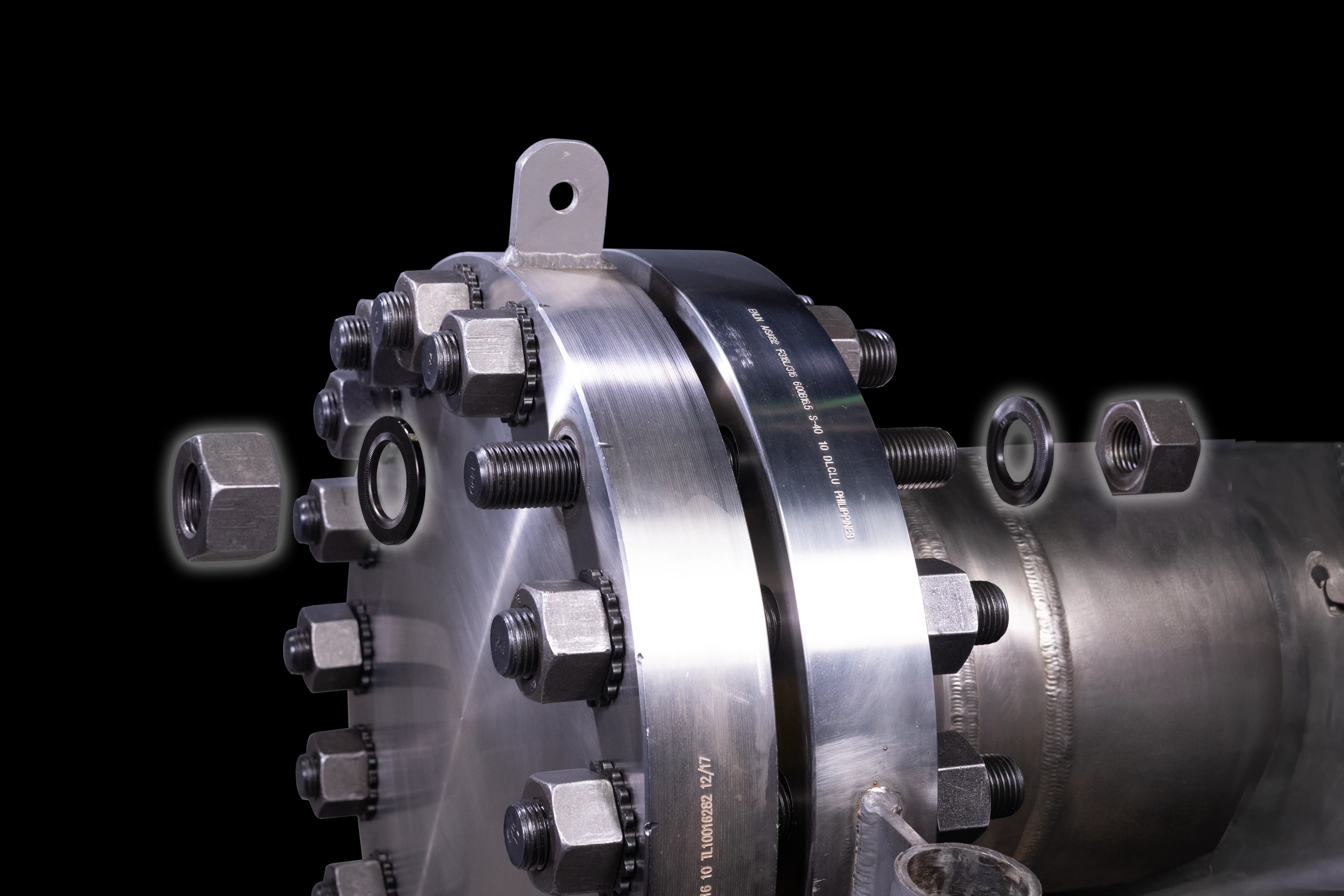 An exploded view of the HYTORC Washer System, including the HYTORC TRUE-LOCK Washer and the HYTORC Backup Washer, on an application.