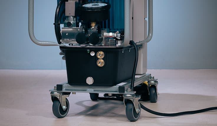 A close-up of the integrated wheels on the HY-EX 3-Stage Electric Hydraulic Pump