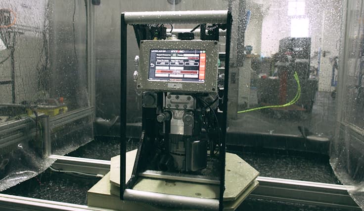 The LIGHTNING Smart Battery-Operated Hydraulic Pump in a simulated rain environment