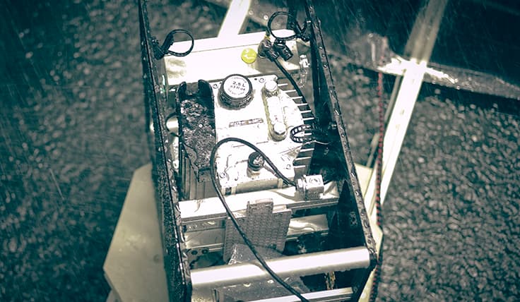 The LIGHTNING Standard Battery-Operated Hydraulic Pump in a simulated rain environment.