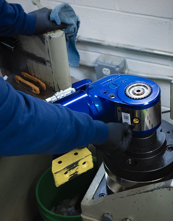 A HYTORC technician calibrating an MXT+ Hydraulic Torque Wrench