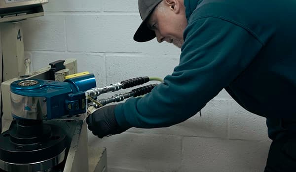 A HYTORC technician calibrating an MXT+ Hydraulic Torque Wrench