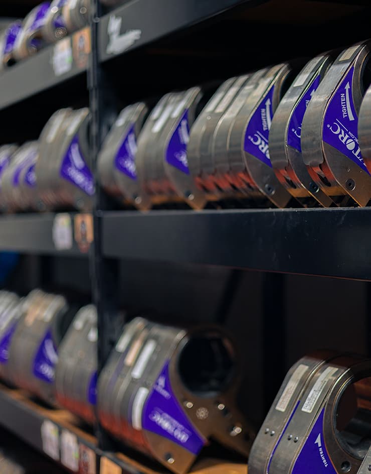 A collection of HYTORC's STEALTH Hydraulic Torque Wrenches on a shelf